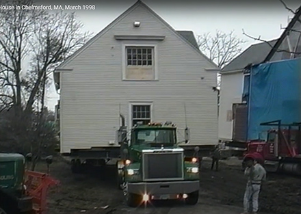 Carriage House moving past Scoboria House